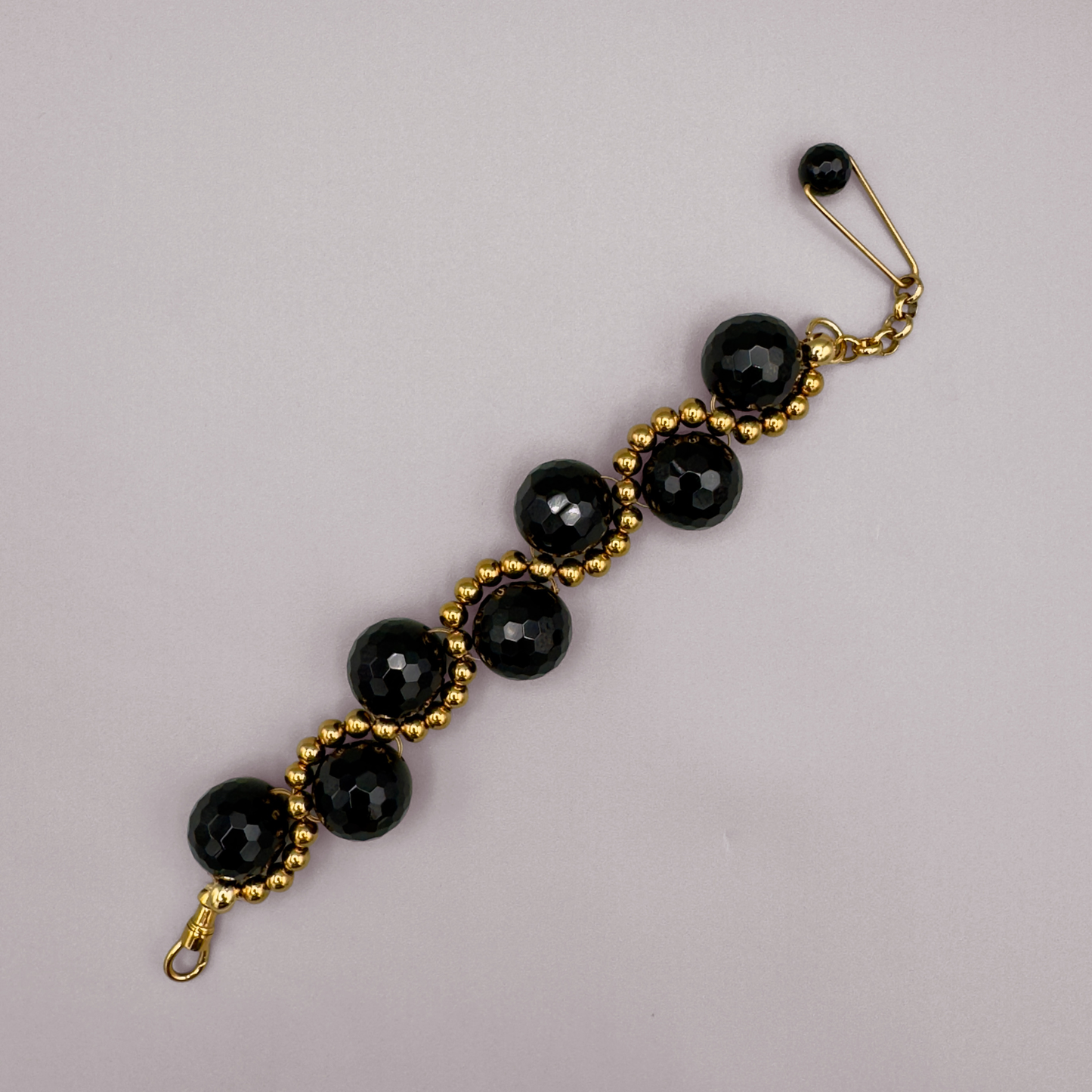 ORBITAL O2 Bracelet in Black Onyx + Gold